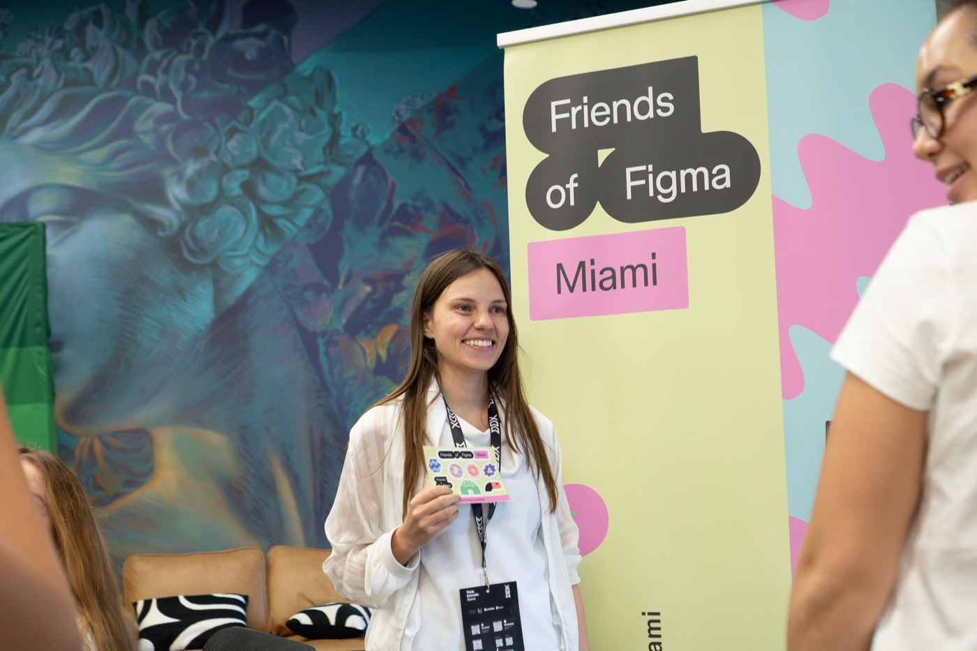 An attendee at the Friends of Figma Miami banner